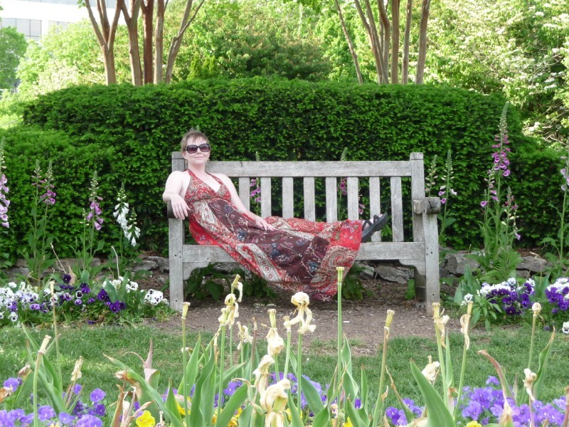 Annie in flower garden.JPG